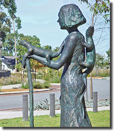 Public Artwork, Wellard, Western Australia, Figure of female bush guardian with lizard